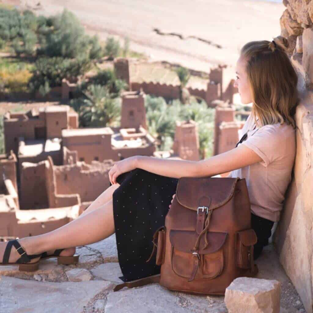 Morocco desert tour a solo traveler enjoying a-spectacular landcape over ait ben haddou kasbah